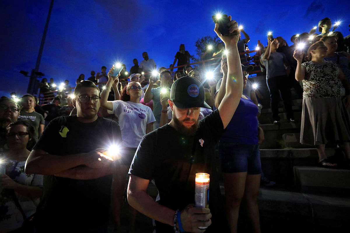 Francisco Castaneda joins mourners taking part in a vigil at El Paso High School after a mass shooting at a Walmart store in El Paso, Texas, US on 3 August. Photo: Reuters