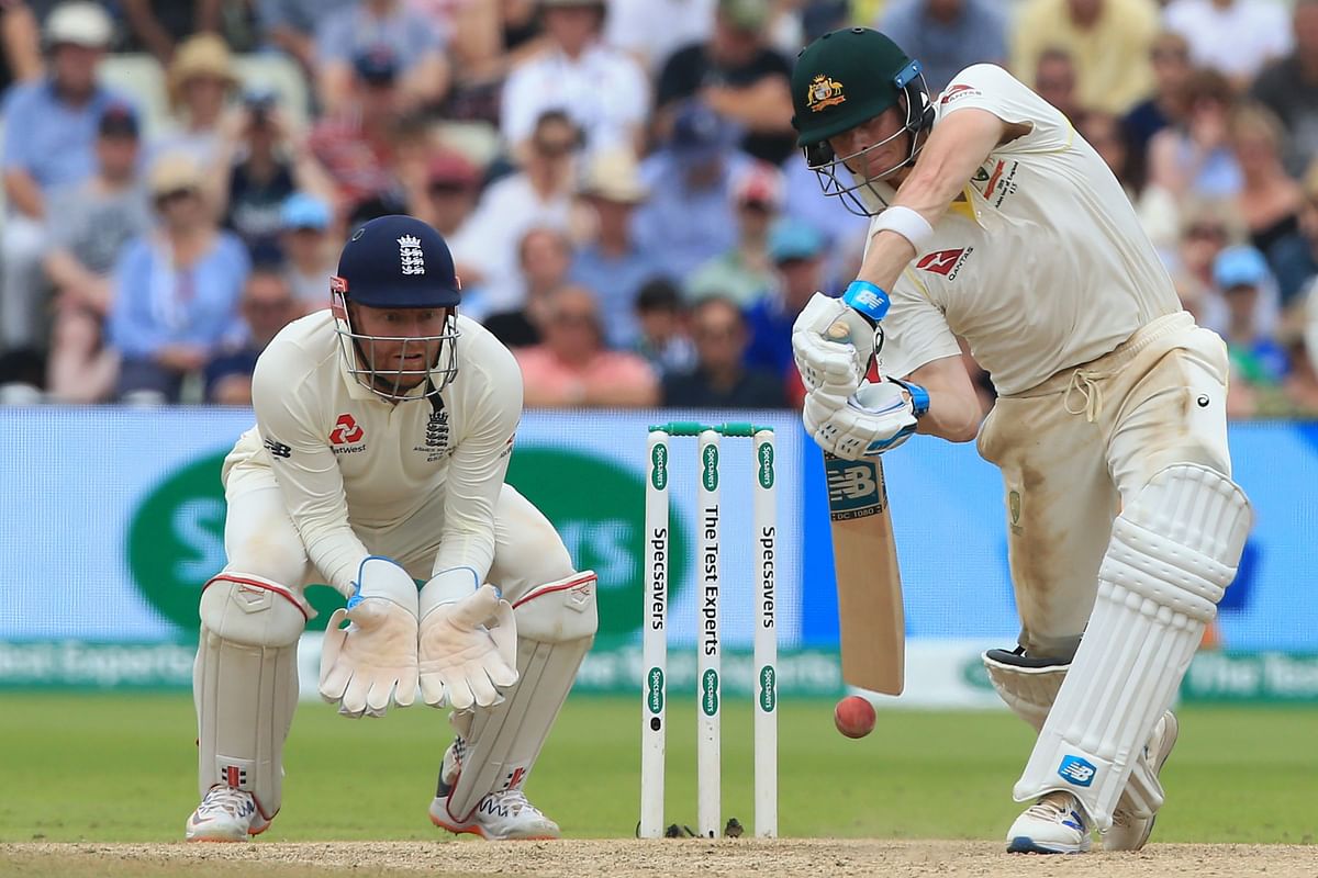 Australia`s Steve Smith (R) plays a shot as England`s Jonny Bairstow (L) keeps wicket during play on the fourth day of the first Ashes cricket Test match between England and Australia at Edgbaston in Birmingham, central England on 4 August 2019. Photo: AFP