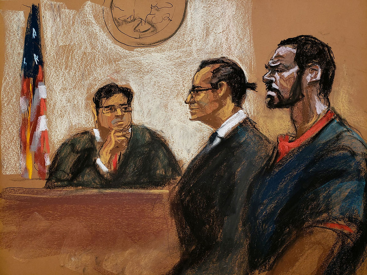 Singer R Kelly stands next to his lawyer Douglas Anton as he attends his arraignment on charges of racketeering and sex trafficking before Magistrate Judge Steven Tiscione in federal court in this court sketch in New York, US on 2 August. Photo: Reuters