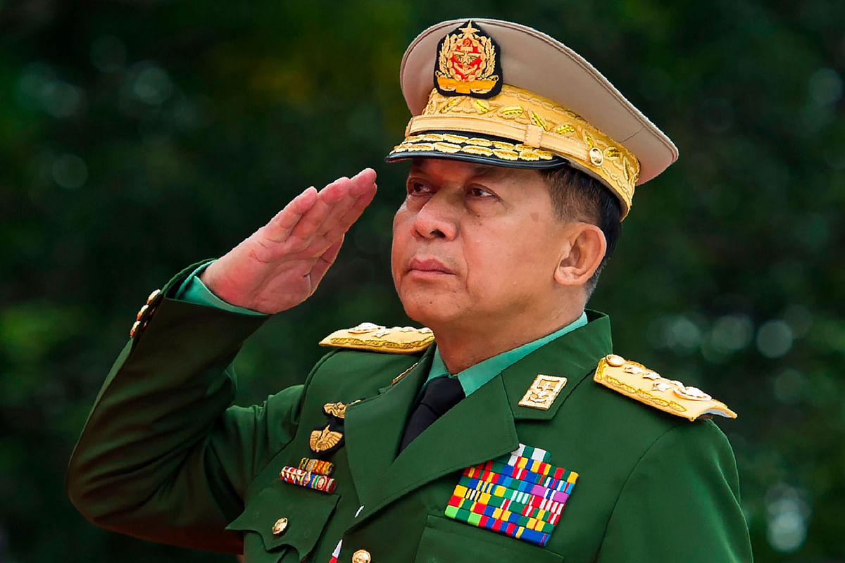 In this file photo taken on 19 July 2018, Myanmar`s Chief senior general Min Aung Hlaing, commander-in-chief of the Myanmar armed forces, salutes to pay his respects to Myanmar independence hero General Aung San and eight others assassinated in 1947, during a ceremony to mark the 71th anniversary of Martyrs` Day in Yangon. Photo: AFP