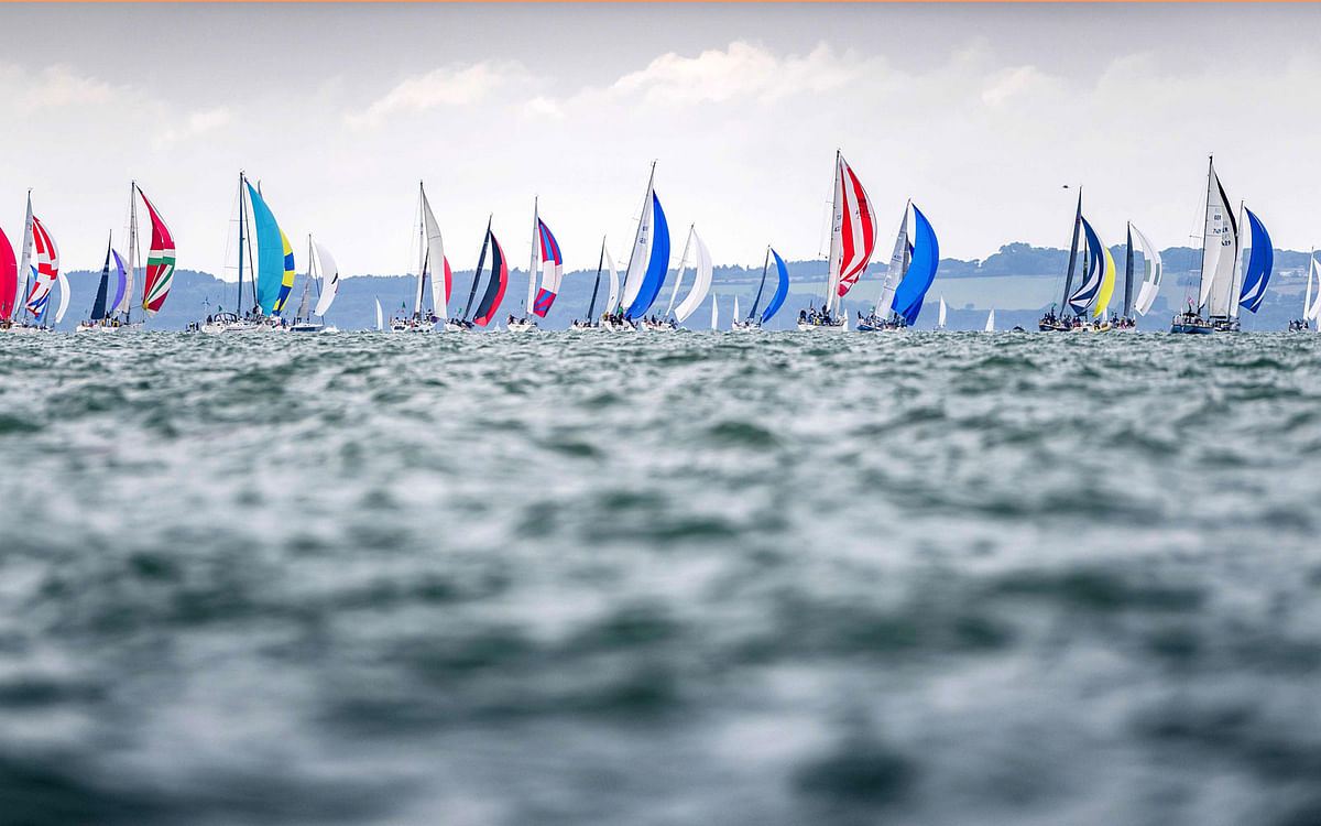 This handout image taken on and released by Quinag on 3 August 2019, shows the race start for the IRC Four class at the Rolex Fastnet Race 2019, off the south coast of England. Photo: AFP