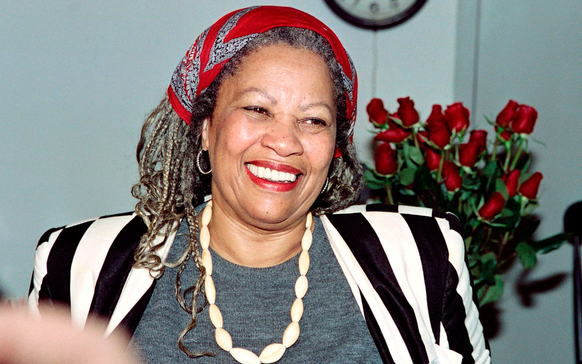 In this file photo taken on 7 October 1993 US author Toni Morrison smiles in her office at Princeton University in New Jersey, while being interviewed by reporters. Photo: AFP