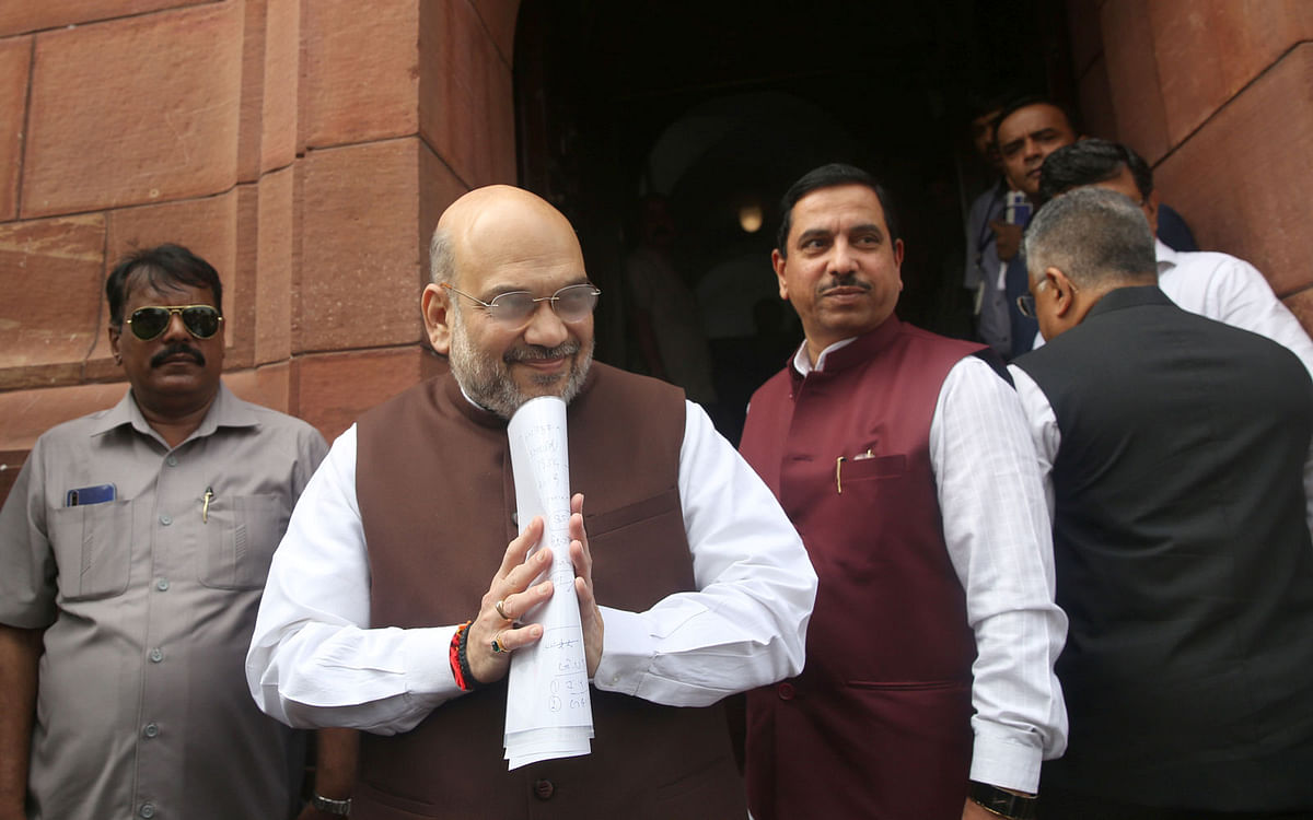 India’s home minister Amit Shah greets the media upon his arrival at the parliament in New Delhi, India, on 5 August 2019. Photo: Reuters