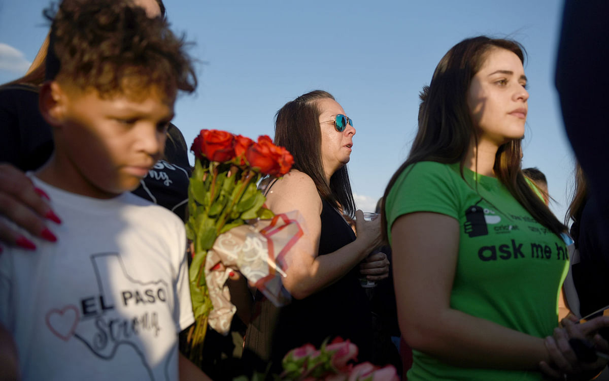 People gather to pay their respects at a growing memorial three days after a mass shooting at a Walmart store in El Paso, Texas, US on 6 August. Photo: Reuters