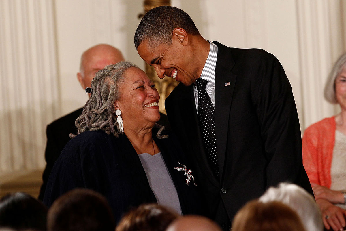 Novelist Morrison smiles with President Obama as he prepares to award her a 2012 Presidential Medal of Freedom at the White House in Washington. Photo: Reuters