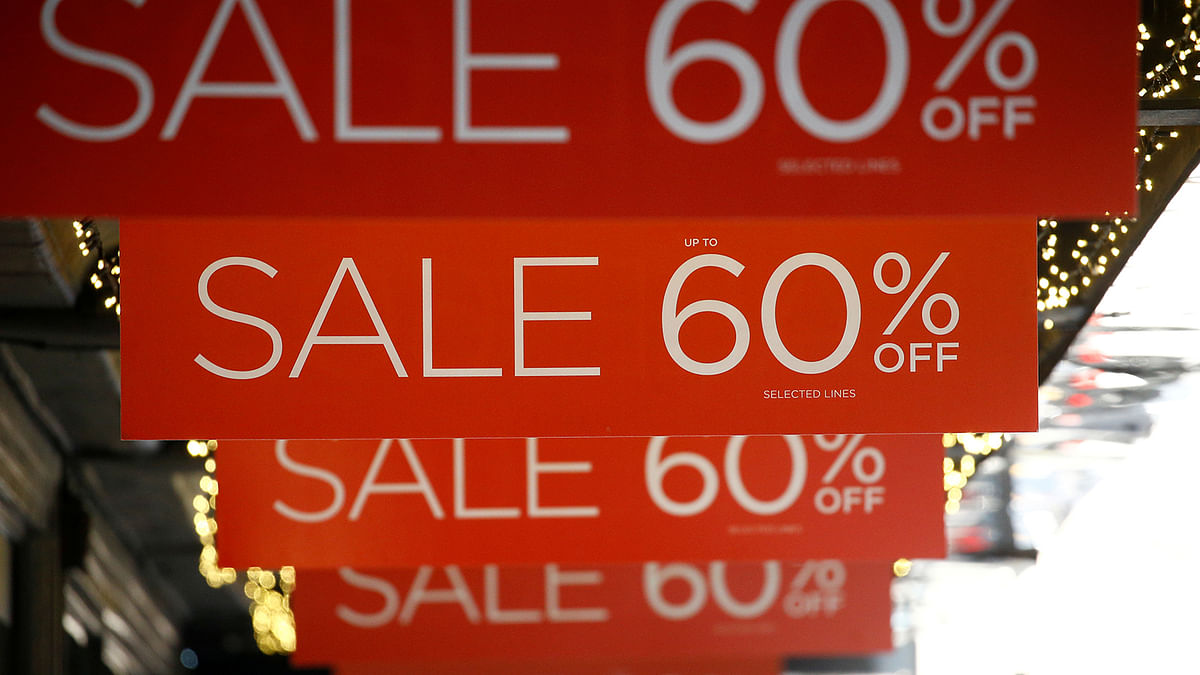 Sale signs are displayed at the front of a shop, in London, Britain on 27 December 2018. Reuters File Photo