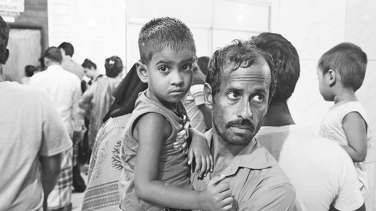 Little Sumaiya has dengue but her father had to take her back home as there was no room in hospital. Photo: Ashraful Alam