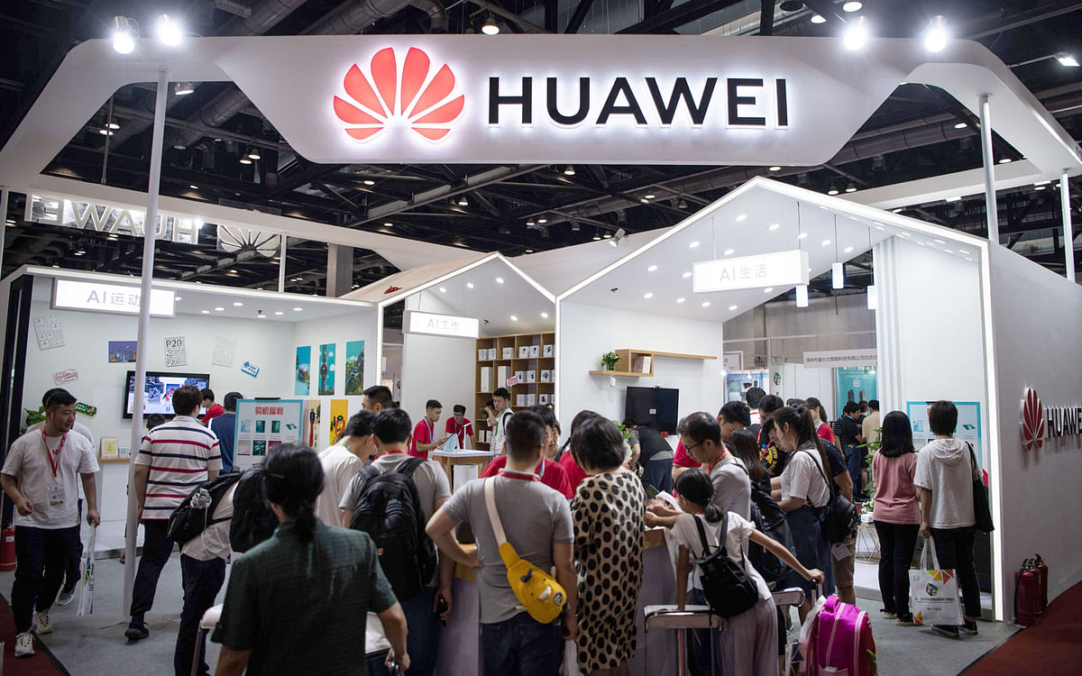 Attendees visit a Huawei exhibition stand during the Consumer Electronics Expo in Beijing on 2 August 2019. Photo: AFP