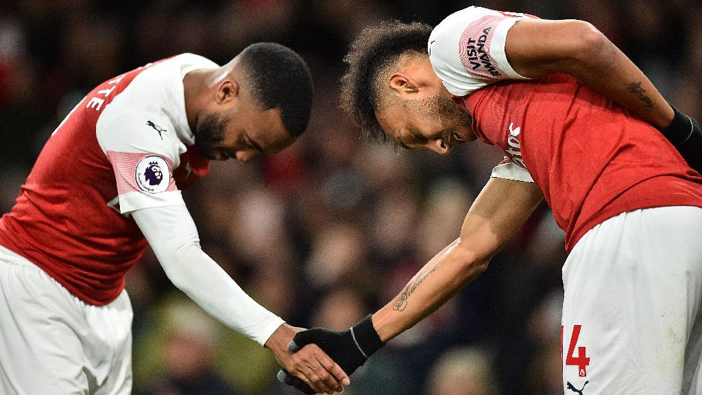 Aubameyang and Lacazette had 35 goals and 19 assists between them last season. AFP