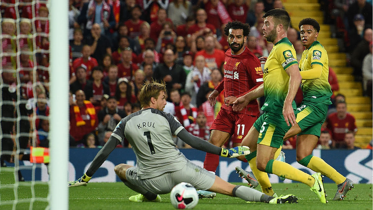 Liverpool`s Egyptian midfielder Mohamed Salah (C) scores the team`s second goal during the English Premier League football match between Liverpool and Norwich City at Anfield in Liverpool, north west England on 9 August 2019. Photo: AFP