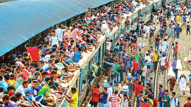 People get into trains risking their lives. Sajid Hossain took this photo at Airport Rail Station, Dhaka on Friday afternoon.