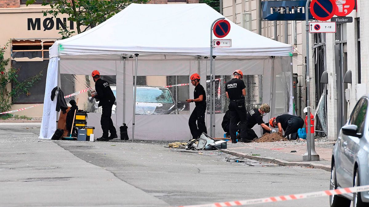Danish police technicians work on Hermodsgade outside a local police station in Copenhagen on 10 August 2019, after the police station was hit by an explosion in the early morning. Photo: AFP