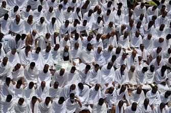 Muslim pilgrims pray at Mount Arafat, also known as Jabal al-Rahma (Mount of Mercy), southeast of the Saudi holy city of Mecca, as the climax of the Hajj pilgrimage approaches on 10 August 2019. Arafat is the site where Muslims believe the Prophet Mohammed gave his last sermon about 14 centuries ago after leading his followers on the pilgrimage. The ultra-conservative kingdom, which is undergoing dramatic social and economic reforms, has mobilised vast resources for the six-day journey, one of the five pillars of Islam. Photo: AFP