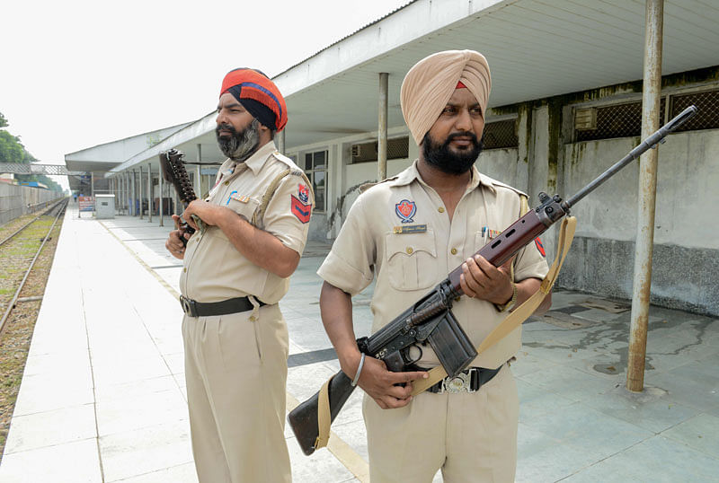 Punjab police security personnel stand guard at the Attari Railway station some 35 kms from Amritsar on 12 August 2019. The Indian Railways on 11 August announced that it has cancelled the Samjhauta Express train at its end of the international border, days after Pakistan suspended services on its side. Photo: AFP