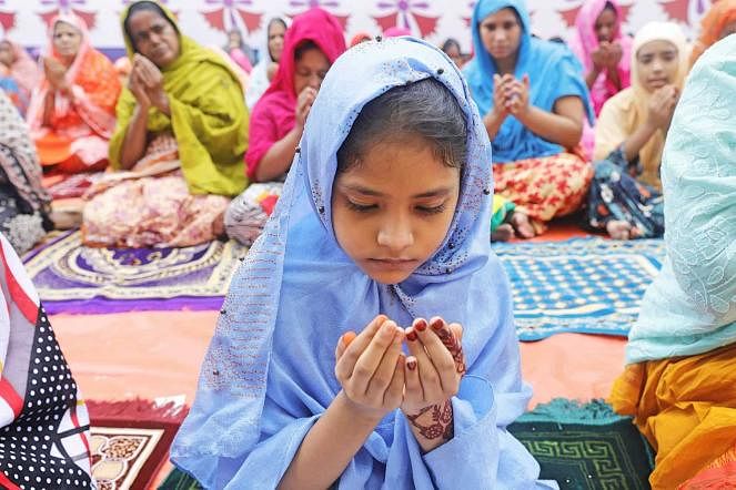 A girl says her Eid prayers in Rajshahi`s Sagarpara on 12 August, 2019. Photo: Sabina Yesmin