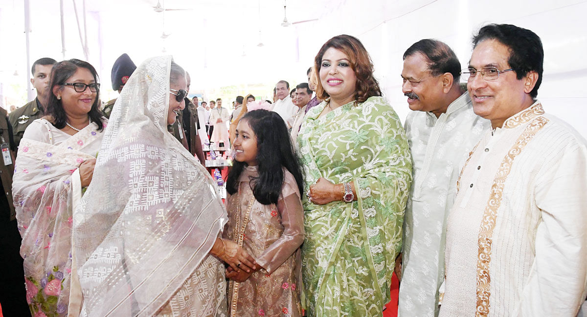 Prime minister Sheikh Hasina exchanges Eid greetings with the cross section of people at her official Ganabhaban residence in Dhaka on the occasion of the holy Eid-ul-Azha on Monday. Photo: PID