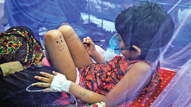 DengueSix-year-old Musnan was under treatment at the Dhaka paediatric hospital. Not being able to get up and play, she idly drew cartoons on her legs, sitting under the mosquito net to avoid being bitten by mosquitoes again. Prothom Alo File Photo