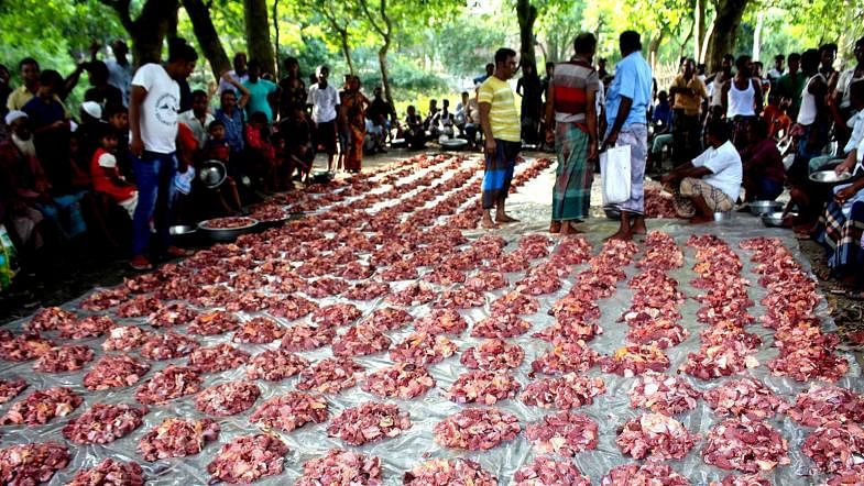 Slaughtered cattle`s meat is distributed to the poor villagers of Jamalpur`s Sarishabari on 13 August, 2019. Photo: Shafiqul Islam