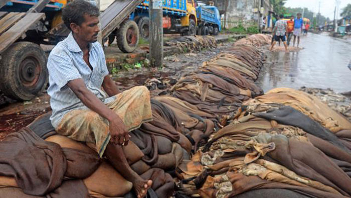 A dejected trader sits on rawhides. Prothom Alo File Photo