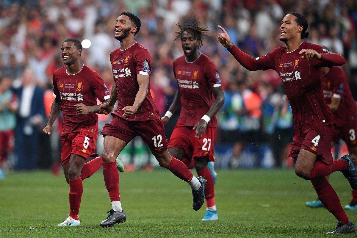 Liverpool’s players celebrate winning the UEFA Super Cup 2019 football match between FC Liverpool and FC Chelsea at Besiktas Park Stadium in Istanbul on Wednesday. Photo: AFP