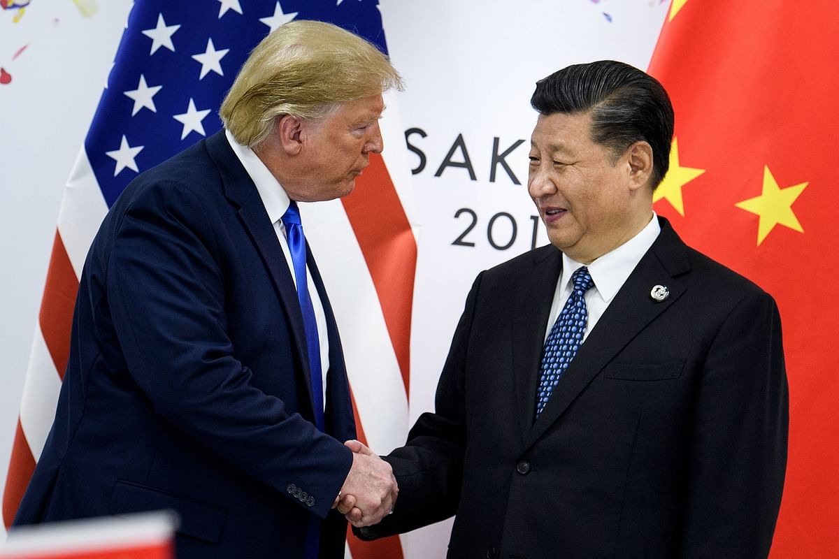 In this file photo taken on 29 June 2019 China`s president Xi Jinping (R) shakes hands with US President Donald Trump before a bilateral meeting on the sidelines of the G20 Summit in Osaka. Photo: AFP