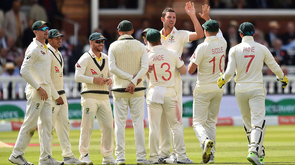 Australia`s Josh Hazlewood (3R) celebrates taking the wicket of England`s Joe Denly for 30 runs on the second day of the second Ashes cricket Test match at Lord`s Cricket Ground in London on 15 August 15, 2019. Photo: AFP