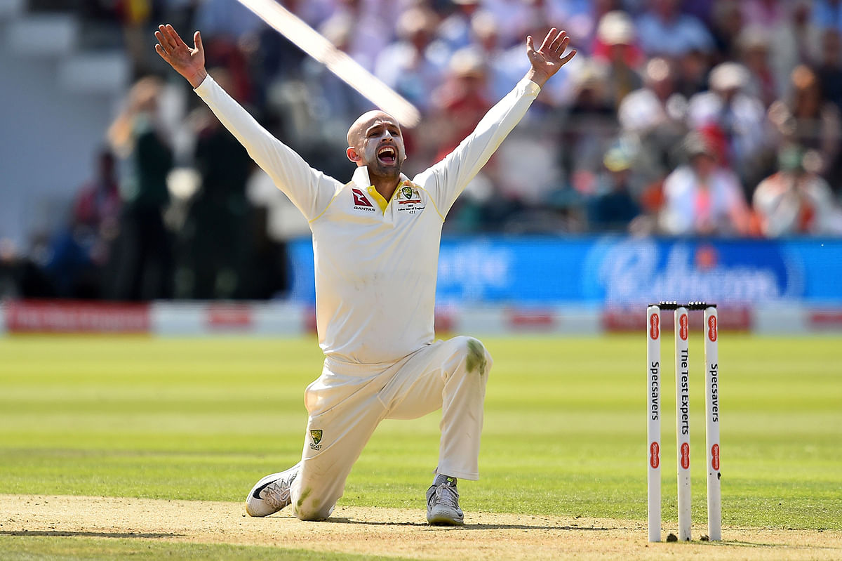 Nathan Lyon celebrates taking the wicket of England’s Ben Stokes (unseen) for 13 runs on the second day of the second Ashes cricket Test match between England and Australia at Lord’s Cricket Ground in London on Thursday. Photo: AFP