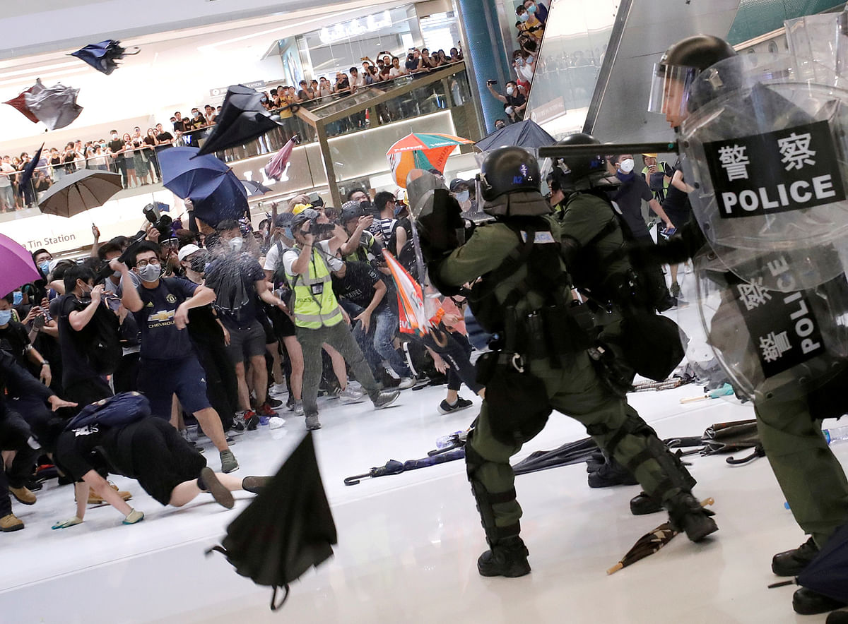 Riot police use pepper spray to disperse pro-democracy activists inside a mall after a march at Sha Tin District of East New Territories, Hong Kong, China on 14 July 2019. Reuters File Photo