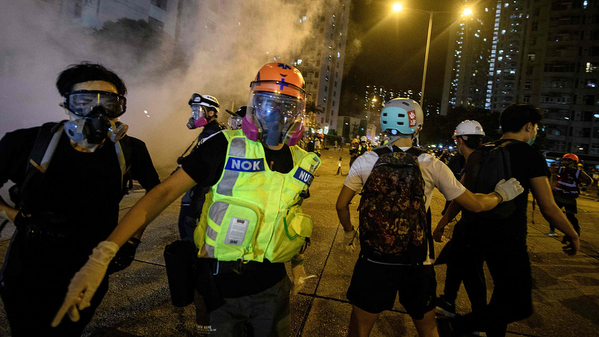 A pro-democracy protester wearing a gas mask, goggles and a helmet during a rally in the Tsim Sha Tsui district of Hong Kong on 11 August 2019. Photo: AFP