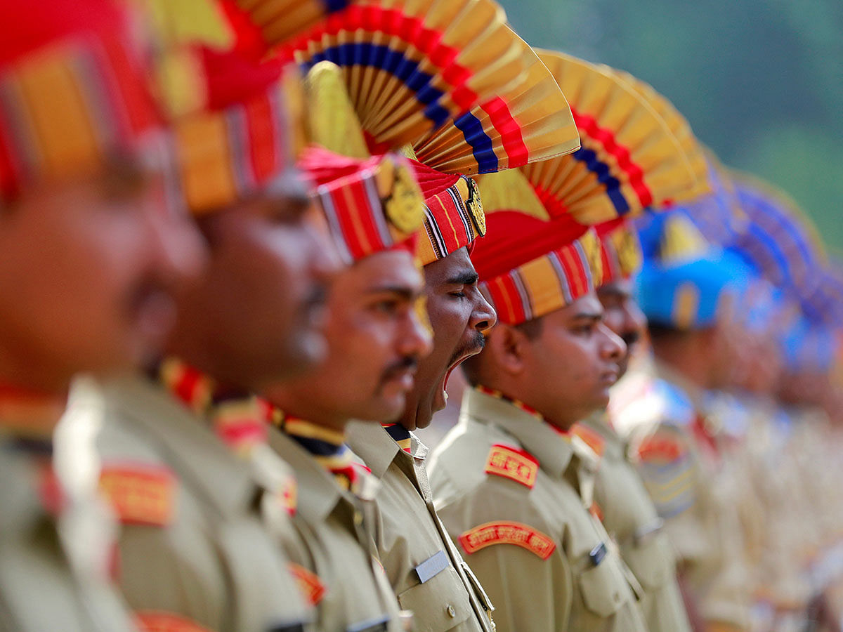 An Indian security force personnel wearing ceremonial dress yawns as he takes part in a parade during India`s Independence Day celebrations, following restrictions after the government scrapped the special constitutional status for Kashmir, in Srinagar on 15 August 2019. Photo: Reuters