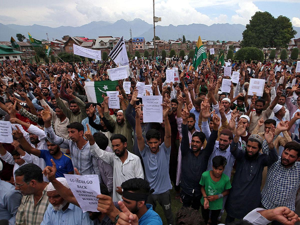 Kashmiris hold placards as they shout slogans at a protest after Friday prayers during restrictions after the Indian government scrapped the special constitutional status for Kashmir, in Srinagar on 16 August 2019. Photo: Reuters