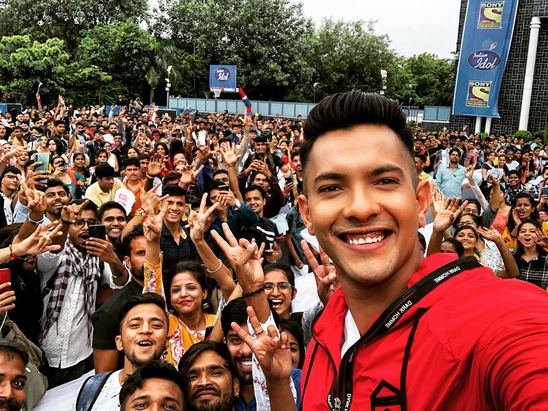 Singer-anchor Aditya Narayan with candidates from the audition process of `Indian Idol 11`. Photo: IANS