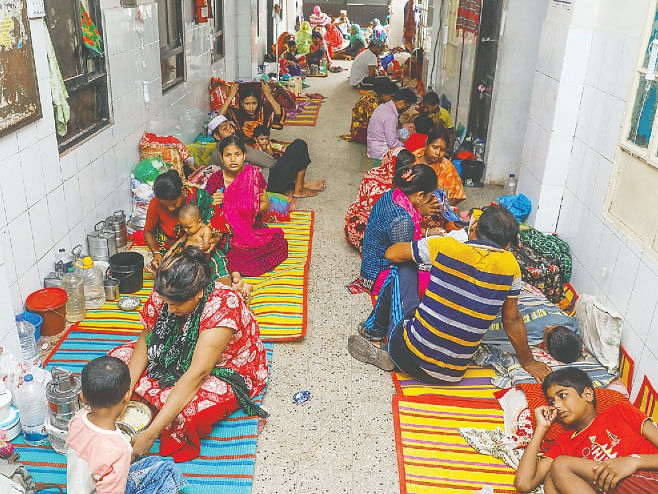 The pediatric ward at Sir Salimullah Medical College Hospital in Dhaka is overcrowded with dengue patients. In this picture taken on 16 August 2019 children are seen at the corridors of the hospital. Photo: Dipu Malakar