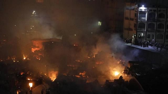 A total of 24 fire-fighting units working to douse Chalantika Slum fire in the capital`s Mirpur on 16 August, 2019. Photo: Dipu Malakar