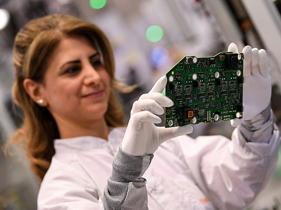An employee of German car parts maker Continental assembles a power electronics component at the factory of the company`s Powertrain unit in Nuremberg, Germany, on 1 March 2019. Reuters File Photo