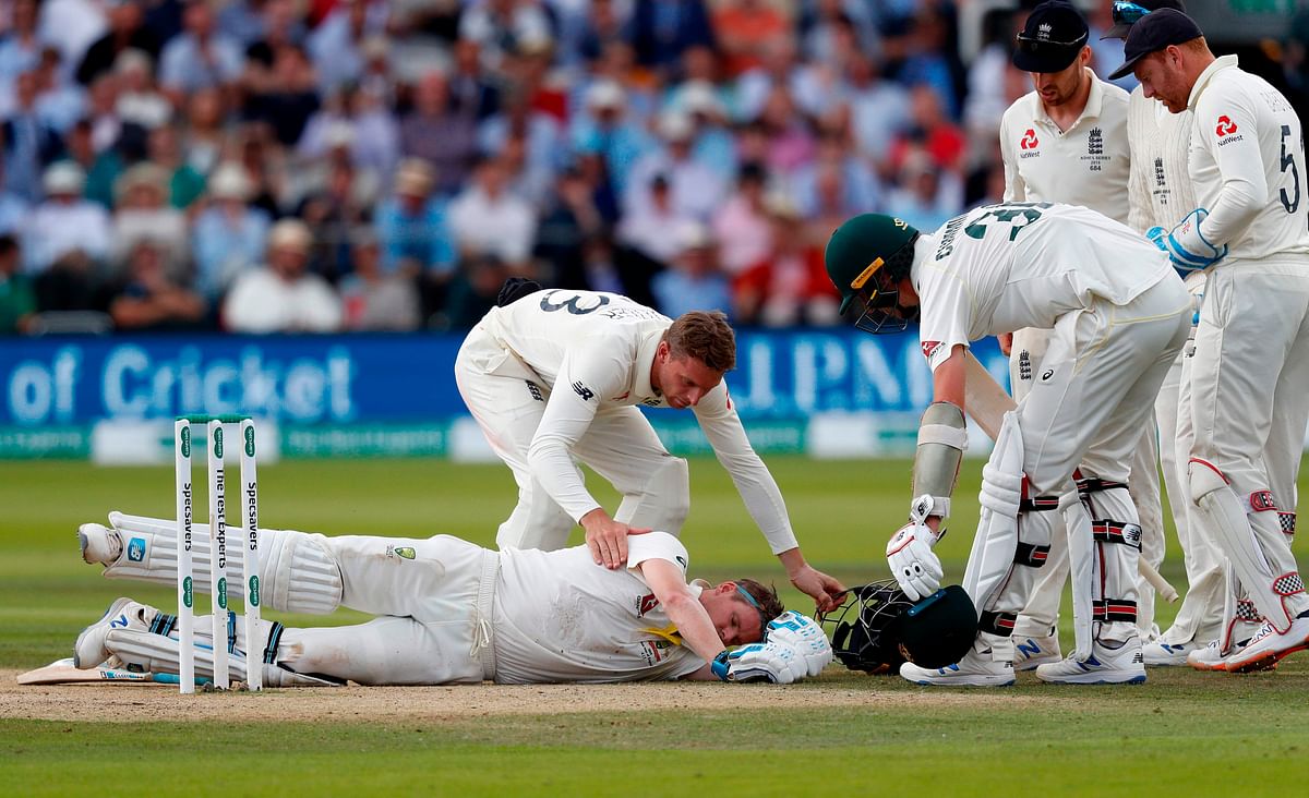 Australia`s Steve Smith lays on the pitch after being hit in the head by a ball off the bowling of England`s Jofra Archer (unseen) during play on the fourth day of the second Ashes cricket Test match between England and Australia at Lord`s Cricket Ground in London on 17 August 2019. Photo: AFP