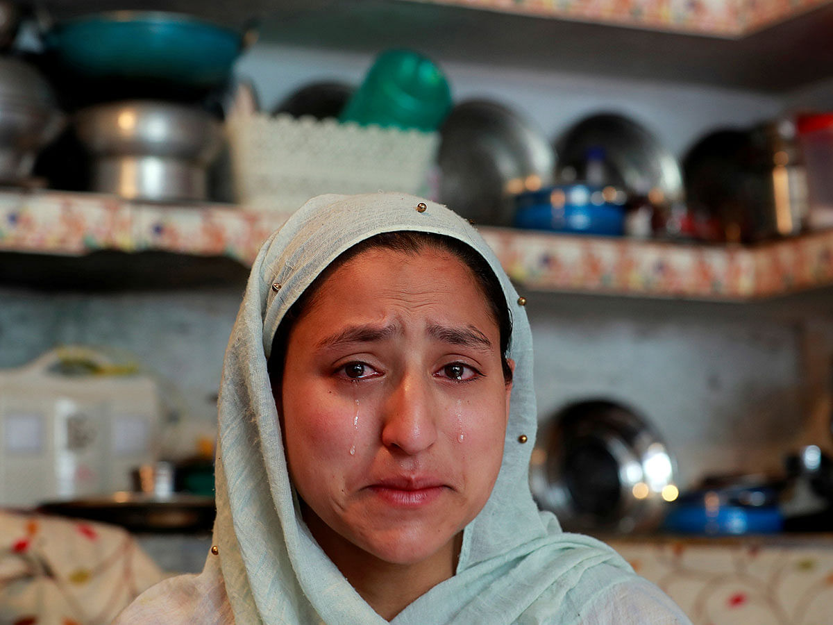 A woman weeps inside her house after her household goods were allegedly damaged by Indian security forces following clashes between protesters and the security forces on Friday evening, during restrictions after the scrapping of the special constitutional status for Kashmir by the government, in Srinagar, on 17 August 2019. Photo: Reuters