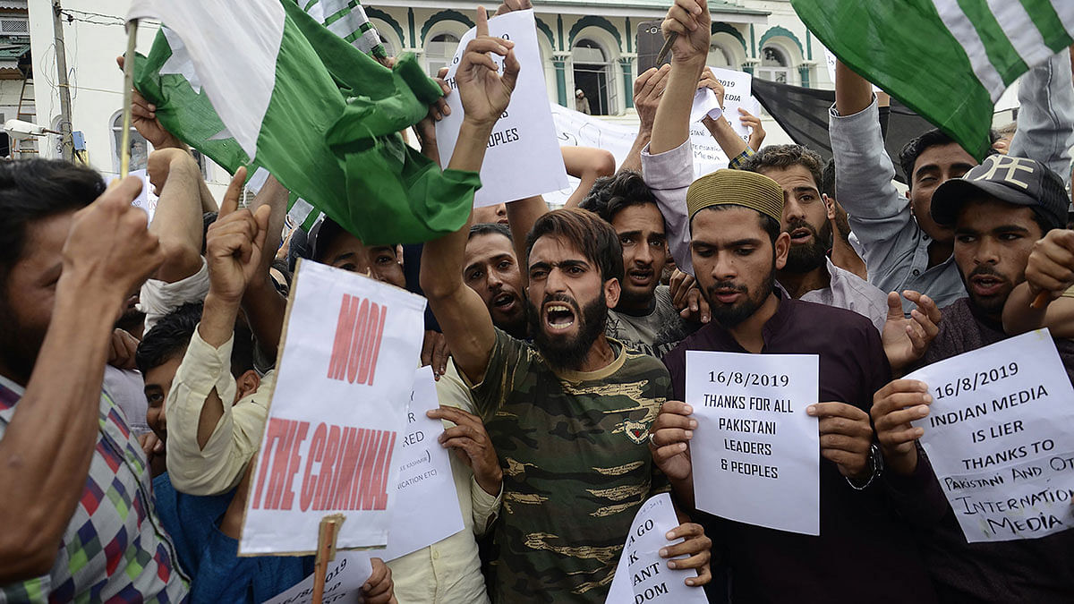 Protesters shout slogans at a rally against the Indian government`s move to strip Jammu and Kashmir of its autonomy and impose a communications blackout, in Srinagar on 16 August. Photo: AFP