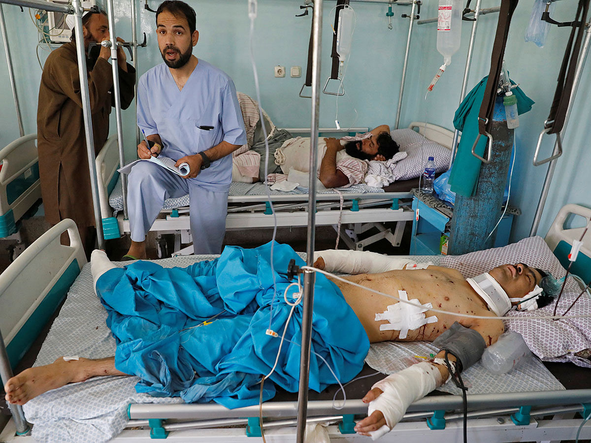 A man rests on a bed while receiving treatment in the hospital after sustaining injuries from a blast at a wedding hall in Kabul, Afghanistan on 18 August 2019. Photo: Reuters
