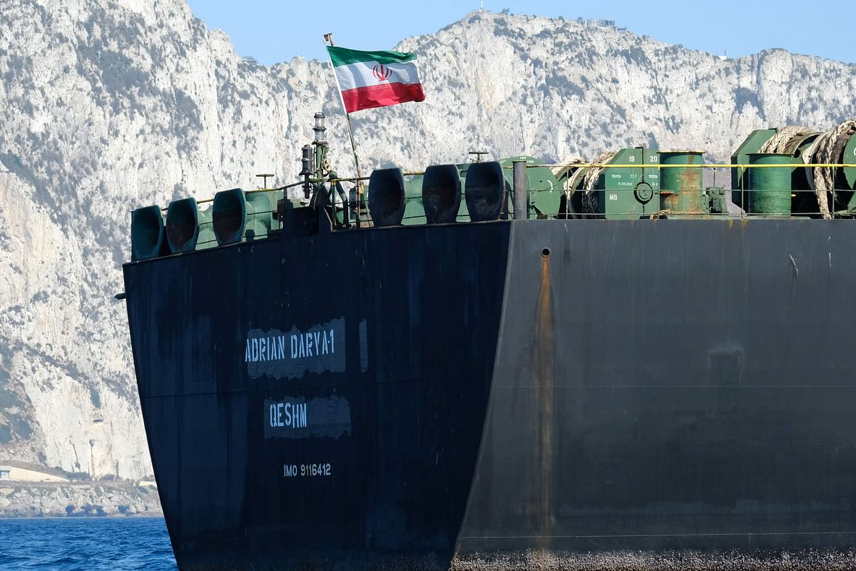 An Iranian flag flutters on board the Adrian Darya oil tanker, formerly known as Grace 1, off the coast of Gibraltar on 18 August 2019. Gibraltar rejected a US demand to seize the Iranian oil tanker at the centre of a diplomatic dispute as it prepared to leave the British overseas territory after weeks of detention. Photo: AFP