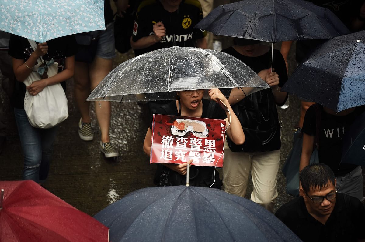 Protesters walk along a street during a rally in Hong Kong on 18 August 2019, in the latest opposition to a planned extradition law that has since morphed into a wider call for democratic rights in the semi-autonomous city. Photo: AFP