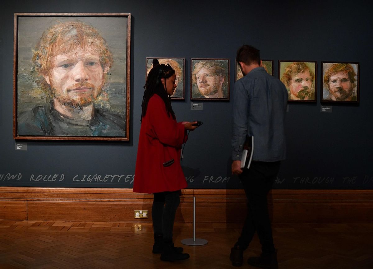 Portraits of British musician Ed Sheeran, painted by Irish artist Colin Davidson, are pictured on display during a press preview of the exhibition `Ed Sheeran: Made in Suffolk` in Ipswich, east England on 19 August 2019. Photo: AFP