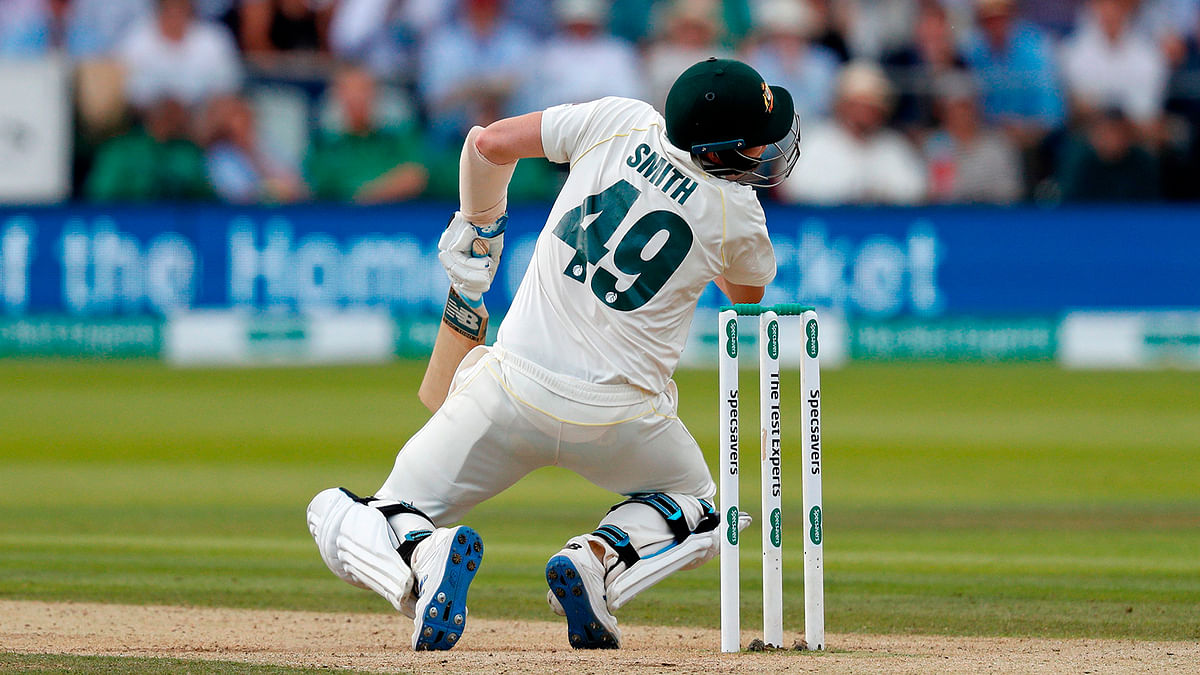 In this file photo taken on 17 August 2019 Australia`s Steve Smith falls to the ground after being hit in the head by a ball off the bowling of England`s Jofra Archer (unseen) during play on the fourth day of the second Ashes cricket Test match at Lord`s Cricket Ground in London. Photo: AFP