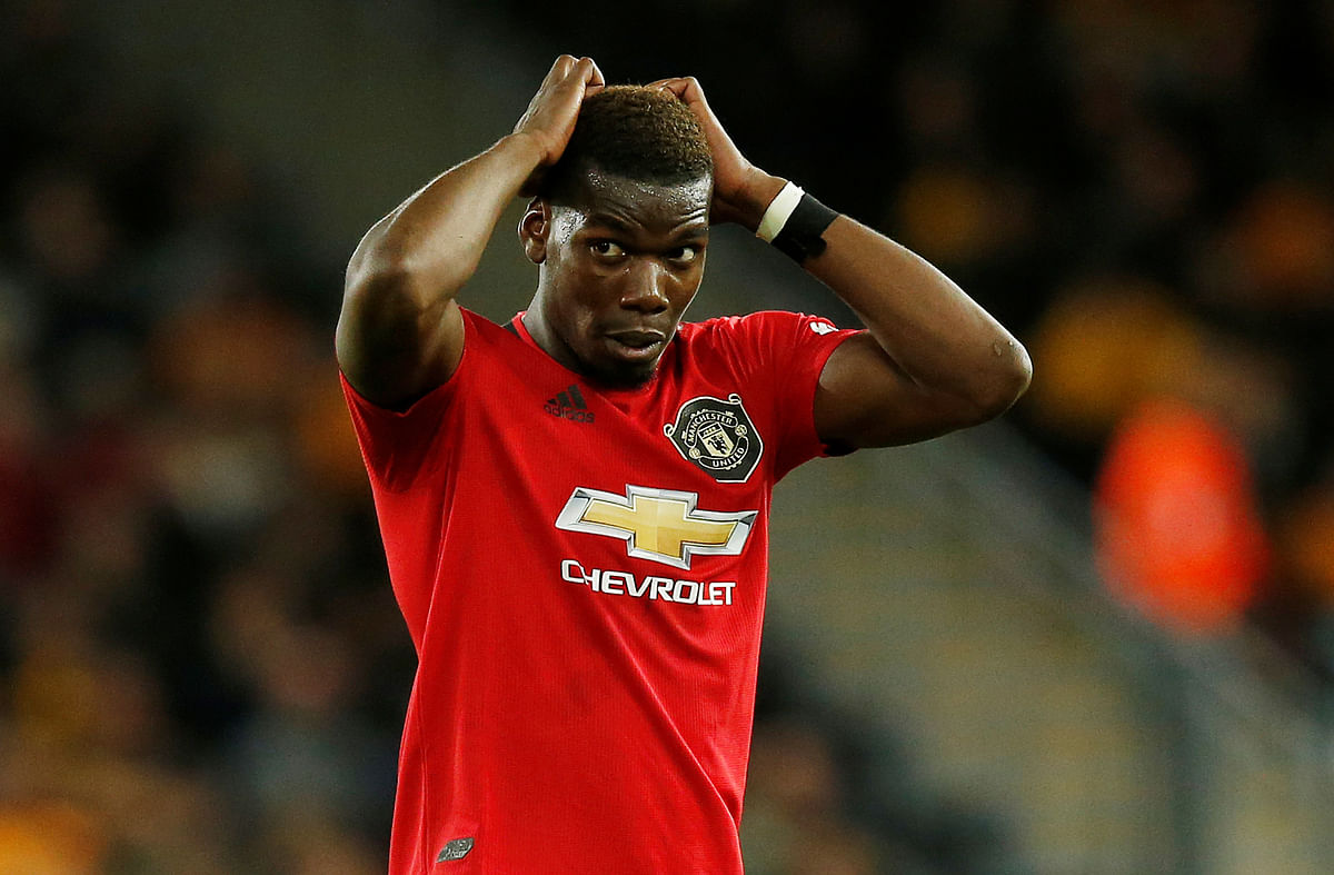 Manchester United’s Paul Pogba reacts after his penalty is saved by Wolverhampton Wanderers’ Rui Patricio in a match between Wolverhampton Wanderers and Manchester United in Molineux Stadium, Wolverhampton, Britain on Monday. Photo: Reuters