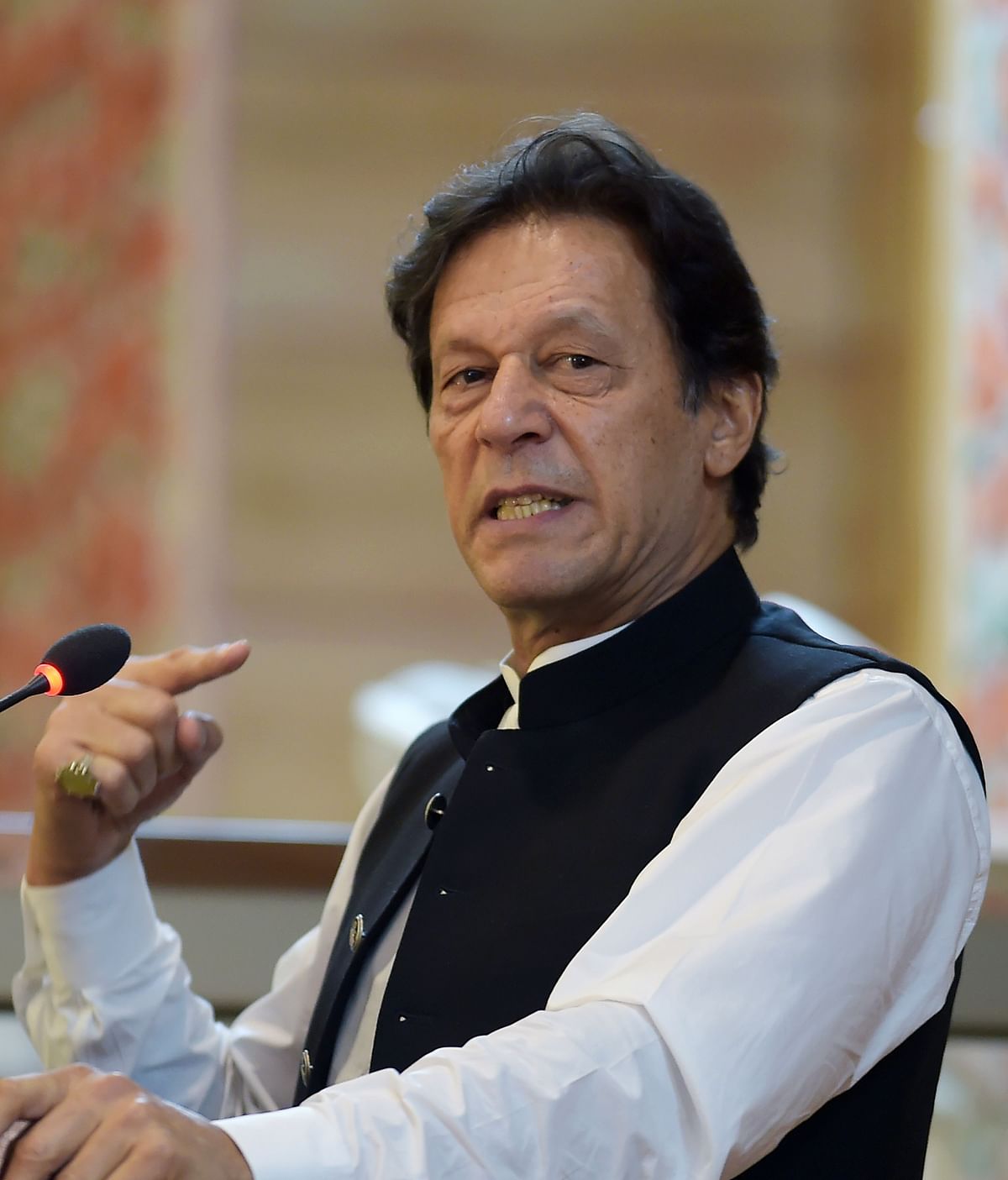 Pakistan`s prime minister Imran Khan addresses the legislative assembly in Muzaffarabad, the capital of Pakistan-controlled Kashmir on 14 August 2019, to mark the country`s Independence Day. Photo: AFP