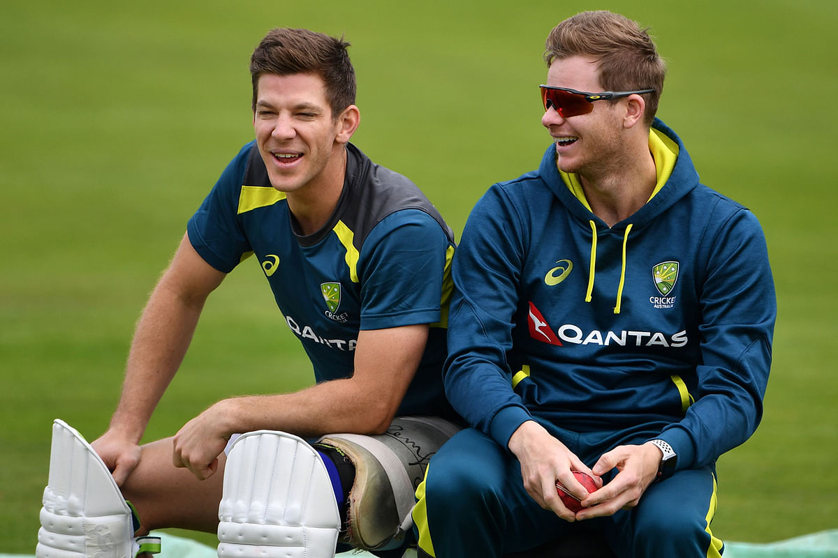 Australia`s captain Tim Paine (L) and Australia`s Steve Smith watch teammates during a practice session at Headingley Stadium in Leeds, northern England, on 21 August 2019 on the eve of the start of the third Ashes cricket Test match between England and Australia. Photo: AFP