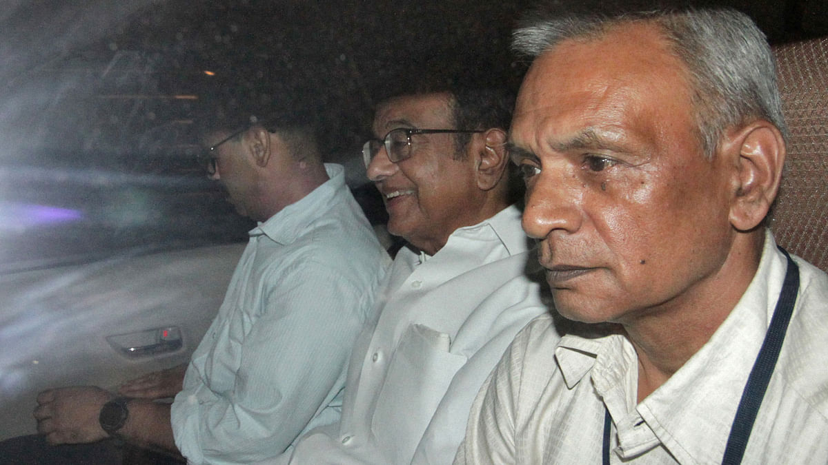 India`s former finance minister Palaniappan Chidambaram (C) sits in a vehicle after he was arrested by the Central Bureau of Investigation (CBI) officials in his residence in New Delhi, India, on 21 August 2019. Photo: Reuters