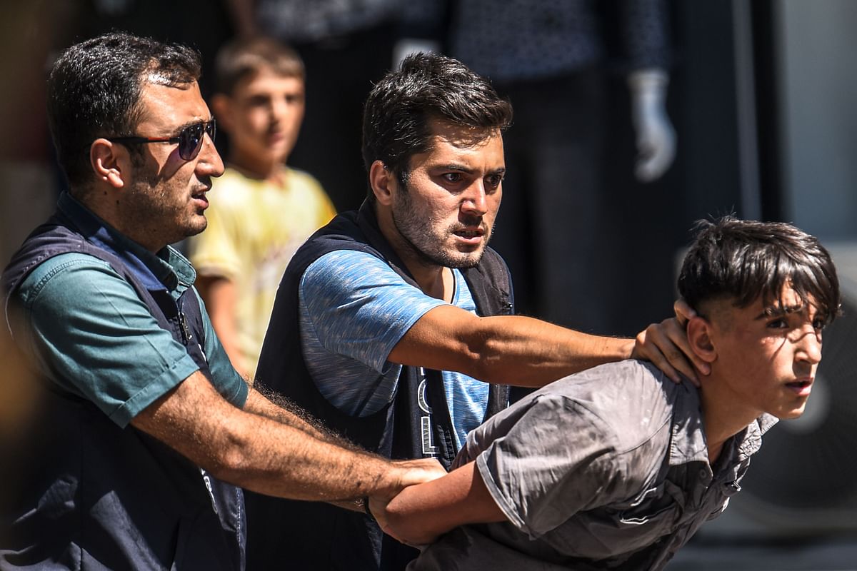 Turkish police officer detain a demonstrator during a protest against the replacement of Kurdish mayors with state officials in three cities, in Diyarbakir, in eastern Turkey on 21 August 2019. Photo: AFP