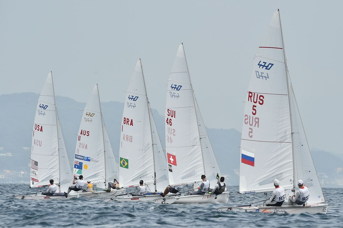 Sailors take part in the men`s two person dinghy 470 class competition during a sailing test event for the Tokyo 2020 Olympic Games, off the coast Enoshima in Kanagawa Prefecture, on 21 August 2019. Photo: AFP