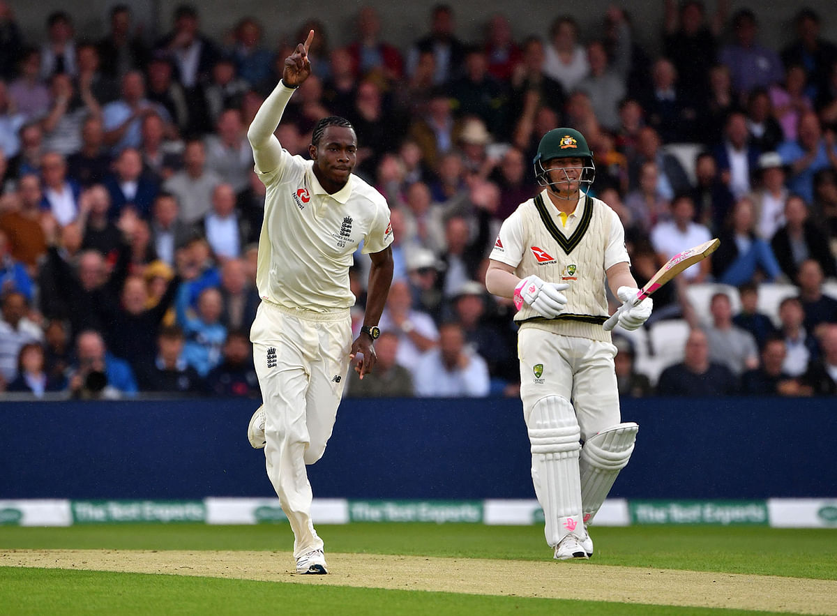 England`s Jofra Archer (L) celebrates taking the wicket of Australia`s Marcus Harris (unseen) on the first day of the third Ashes cricket Test match between England and Australia at Headingley Stadium in Leeds, northern England, on 22 August, 2019. Photo: AFP